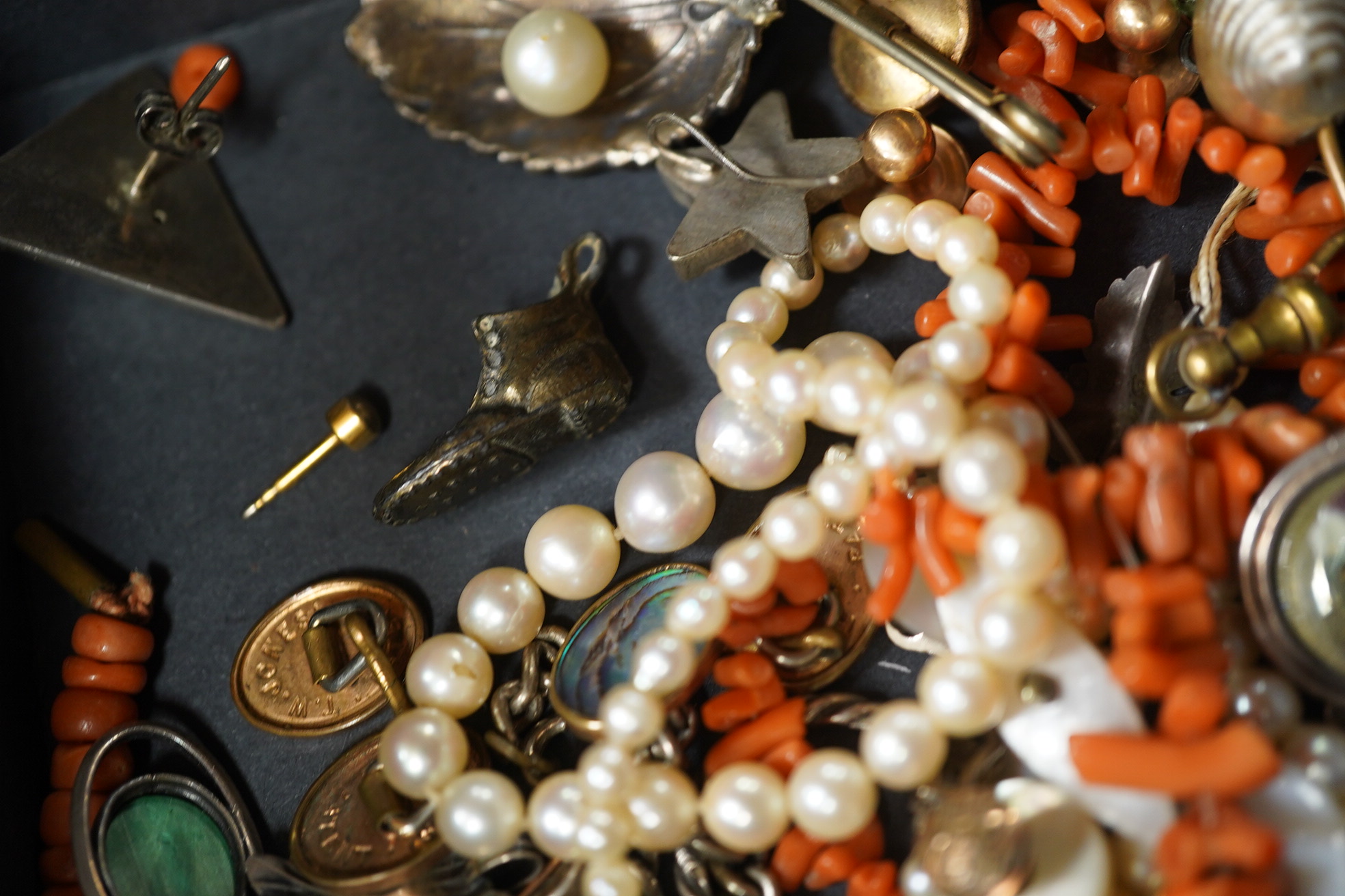 A quantity of assorted mainly costume jewellery including tortoiseshell and pique pendant, coral necklace, cultured pearl necklace, etc. Condition - poor to fair